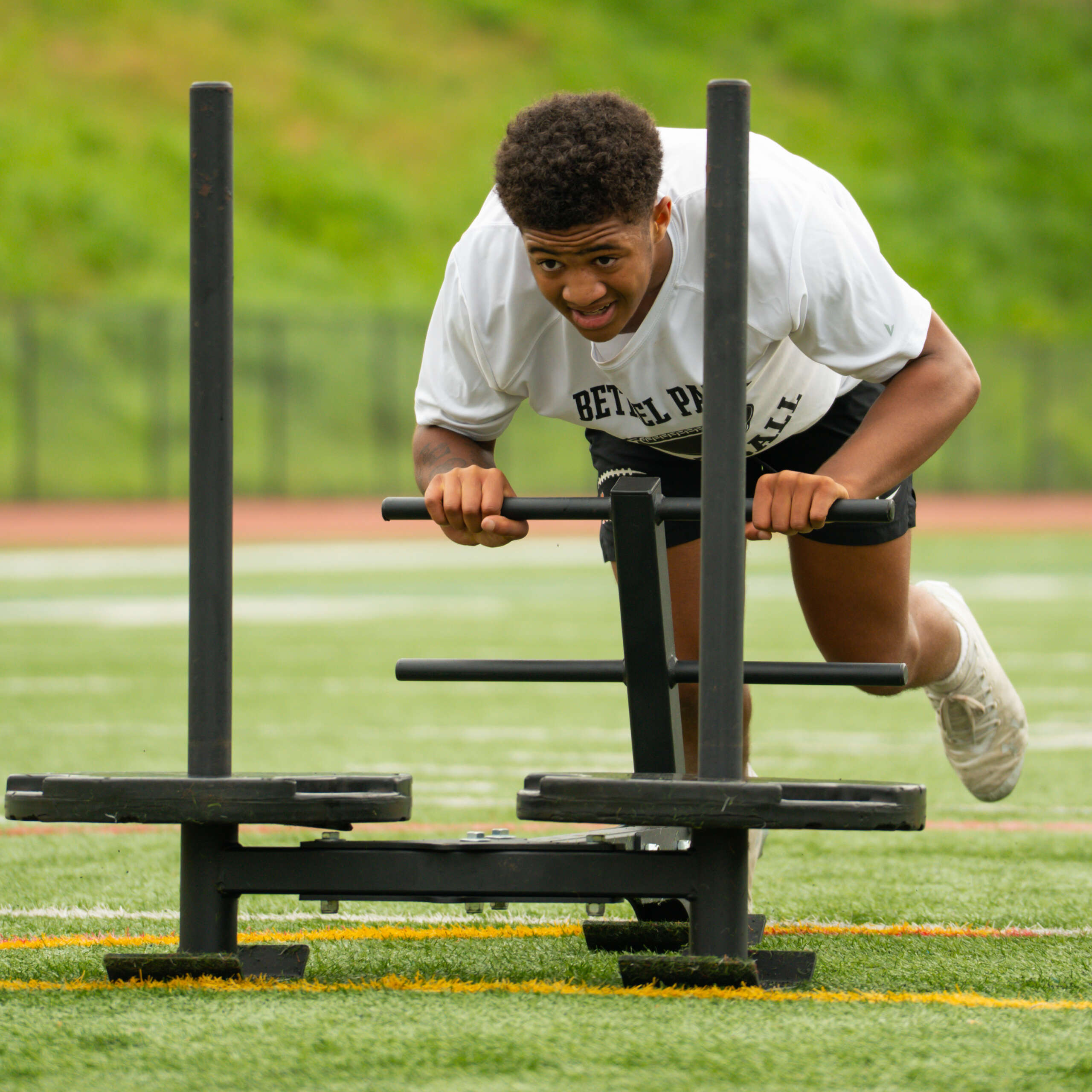 Athlete lifting explosively with bar speed technology